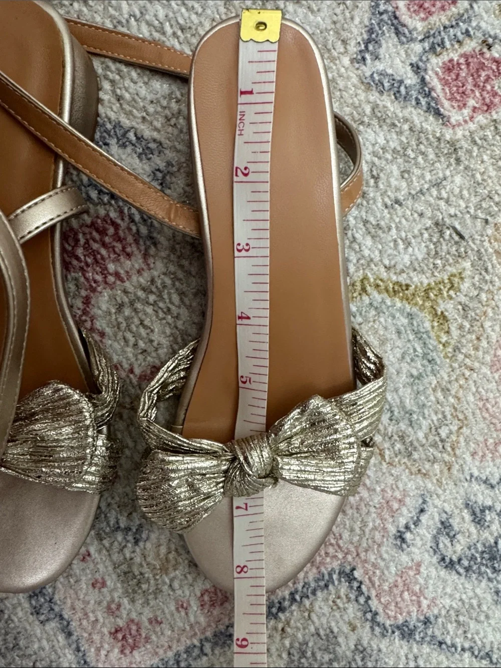 Girls gold ankle wrap sandals with bow.